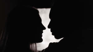 Shadowed Lovers Embrace Wallpaper