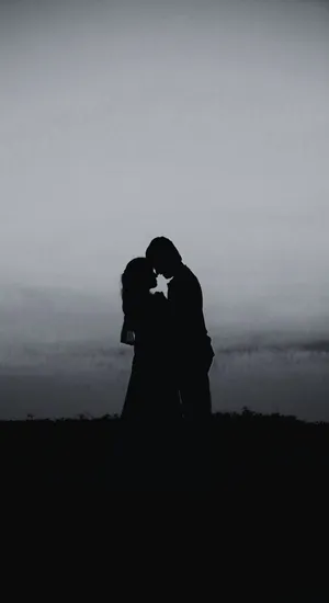 Shadowed Lovers Embrace Wallpaper