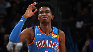 Shai Gilgeous-alexander Gesturing Okay Hand Sign On The Court Wallpaper