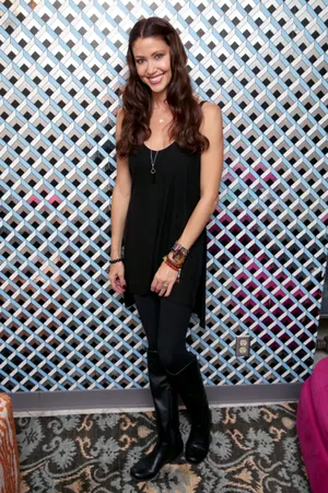 Shannon Elizabeth Posing In A Beautiful Floral Dress Wallpaper