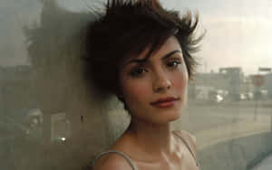 Shannyn Sossamon Posing In A Beautiful Outfit With An Intense Gaze. Wallpaper