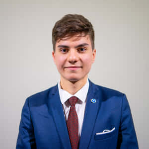 Sharp Navy Blue Suit With Polka Dot Tie Wallpaper