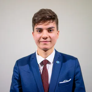 Sharp Navy Blue Suit With Polka Dot Tie Wallpaper