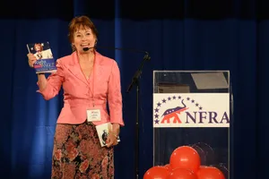 Sharron Angle On Stage With Book Wallpaper