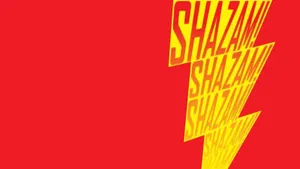 Shazam Superhero Logo Illuminated Against Dark Background Wallpaper
