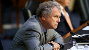 Sherrod Brown Attentively Listening To Testimony Wallpaper