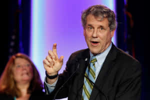 Sherrod Brown Gesturing During Speech Wallpaper