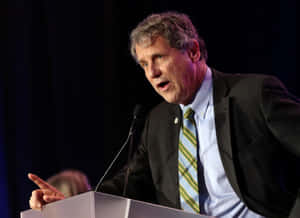 Sherrod Brown Leaning Into Speech Wallpaper