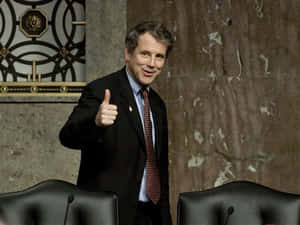 Sherrod Brown Offering A Thumbs Up Wallpaper