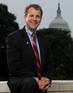 Sherrod Brown With Capitol Dome Wallpaper