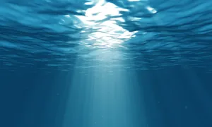 Shining Light Seeping Through A Blue Underwater World Wallpaper