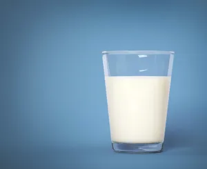 Shiny Glass Of Milk Pale Blue Background Wallpaper