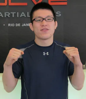 Shinya Aoki, A Dominating Force In Mixed Martial Arts, Posing In His 2011 Evolve Mma Gear. Wallpaper