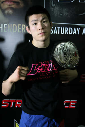 Shinya Aoki Asserting Dominance In The Strikeforce World Championship Tripleheader Wallpaper