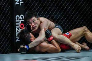 Shinya Aoki Pinning Down Opponent Wallpaper