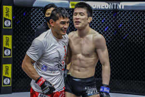 Shinya Aoki Smiling With Eduard Folayang Wallpaper