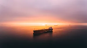 Ship Under Orange Skies Wallpaper