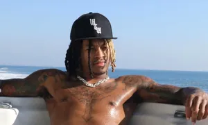 Shirtless Manwith Haton Boat Wallpaper