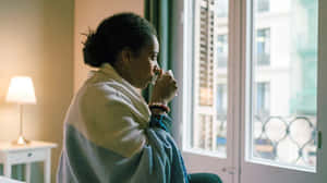 Shivering Woman Drinking Coffee [wallpaper] Wallpaper