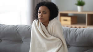 Shivering Woman Holding Blanket [wallpaper] Wallpaper
