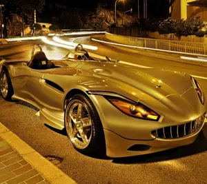 Showcasing Beautiful, Shining Gold Cars Wallpaper