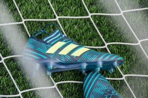 Showing Off Their Speed In Adidas Cleats Wallpaper