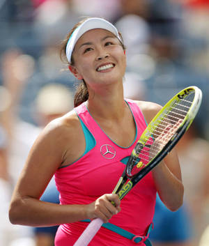 Shuai Peng: A Beacon Of Enthusiasm In Tennis Wallpaper