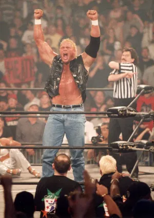 Sid Vicious Inside The Ring With His Hands Up Wallpaper