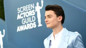 Side Profile Of Noah Schnapp At Sag Awards Wallpaper