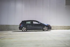 Side-view Of Blue Volkswagen Golf Gti Wallpaper