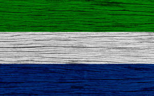 Sierra Leone Flag On Wooden Surface Wallpaper