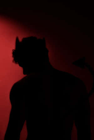 Silhouetteof Demon Figure Wallpaper