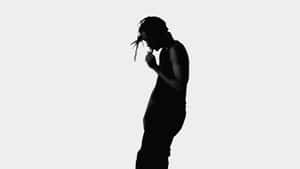 Silhouetteof Manwith Dreadlocks Wallpaper