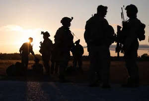 Silhouettes Of Humanitarian Workers Wallpaper