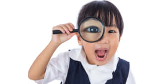 Silly Myopic Kid Playing With Reading Lens Wallpaper