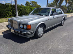 Silver Bentley Turbo R Parked Outdoors Wallpaper