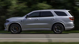 Silver Dodge Durango On The Move Wallpaper