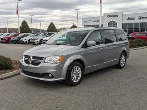 Silver Dodge Grand Caravan Dealership Lot Wallpaper