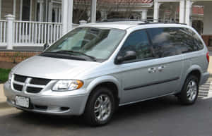 Silver Dodge Grand Caravan Parked Wallpaper