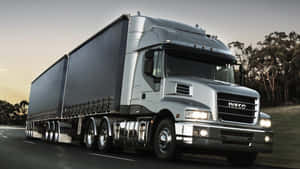 Silver Semi Truck On Road Wallpaper