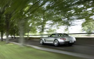 Silver Sports Car Speeding Wallpaper