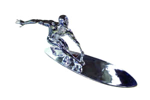 Silver Surfer Figurine On Surfboard Wallpaper