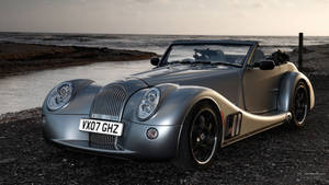 Silver Vintage Car In Shore Wallpaper