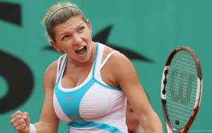 Simona Halep Mastering A Forehand Stroke On Court Wallpaper