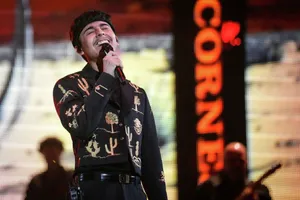 Singer Performanceon Stage Wallpaper