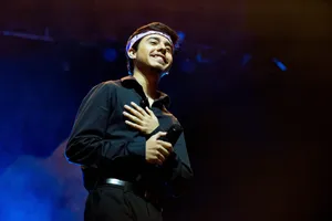 Singer Performingon Stage Wallpaper