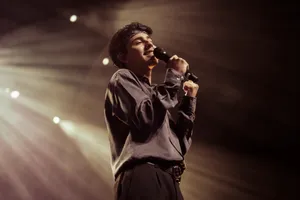 Singer Performingon Stage Wallpaper