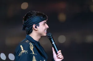 Singer Performingon Stage Wallpaper