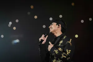 Singer Performingon Stage Wallpaper