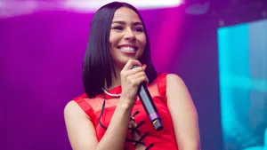 Singer Smiling On Stage.jpg Wallpaper